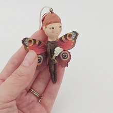 Load image into Gallery viewer, Opposite side view of butterfly girl, held in hand. Pic 7 of 7.
