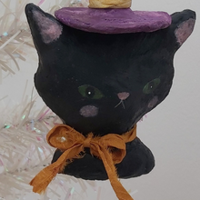 Load image into Gallery viewer, Closer view of spun cotton witch cat face. Pic 3 of 7.
