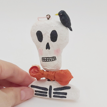 Cargar imagen en el visor de la galería, Spun cotton skeleton bust ornament, held by hand for size comparison. Pic 4 of 6.