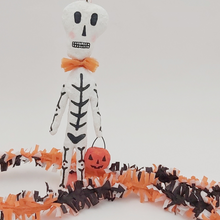 Load image into Gallery viewer, Spun cotton skeleton with jack-o-lantern bucket. Pic 1 of 5.