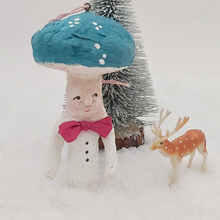 Load image into Gallery viewer, Spun Cotton Mushroom Man Ornament, on fake snow in front of bottle brush tree and vintage plastic deer decoration. Pic 2 of 6.