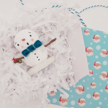 Load image into Gallery viewer, Spun cotton snowman laying in white gift box with white tissue shredding. Pic 4 of 6.