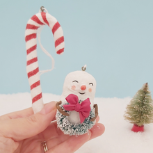 Cargar imagen en el visor de la galería, Spun cotton snowman and candy cane ornaments, held in hand for size comparison. Pic 2 of 7.