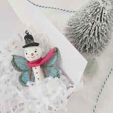 Cargar imagen en el visor de la galería, Spun cotton snowman butterfly ornament, laying in white gift box with white tissue shredding. Pic 4 of 5.