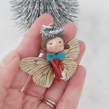 Load image into Gallery viewer, Spun cotton Christmas butterfly angel ornament, held in hand. Pic 1 of 6