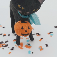 Load image into Gallery viewer, Close view of spun cotton jack-o-lantern held by spun cotton black cat. Pic 5 of 6.