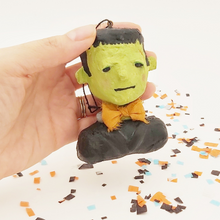 Cargar imagen en el visor de la galería, Spun cotton Frankenstein ornament, held in hand for size comparison. Pic 2 of 9.