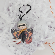 Load image into Gallery viewer, Spun cotton Halloween butterfly laying in gift box with white shredded paper. Pic 4 of 6.