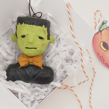 Cargar imagen en el visor de la galería, Spun cotton Frankenstein ornament laying in white gift box on white shredded tissue paper. Pic 6 of 9.