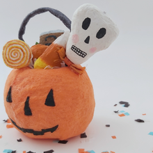 Load image into Gallery viewer, Close up of spun cotton skull and candy in spun cotton pumpkin. Pic 4 of 5.