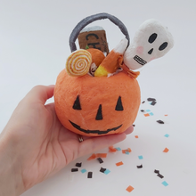 Load image into Gallery viewer, Spun cotton pumpkin bucket, held in hand for size comparison. Pic 2 of 5.