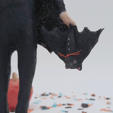 Load image into Gallery viewer, Close up of spun cotton bat hanging upside down in bat girl's hand. Pic 5 of 9.