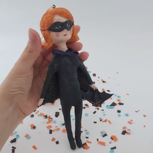 Load image into Gallery viewer, Spun cotton bat girl ornament, held in hand for size comparison. Pic 4 of 9.