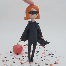 Load image into Gallery viewer, Spun cotton bat girl ornament standing on Halloween confetti. Pic 1 of 9.