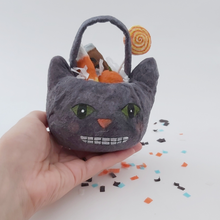 Load image into Gallery viewer, Spun cotton cat Halloween bucket, held in hand for size comparison. Pic 2 of 5.