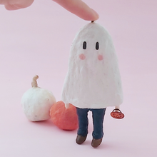 Load image into Gallery viewer, Spun cotton ghost boy ornament, standing with support in front of orange and white spun cotton pumpkins. Pic 1 of 6.