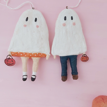 Load image into Gallery viewer, Spun cotton ghost boy and ghost girl ornaments, laying on pink background. Pic 6 of 6.