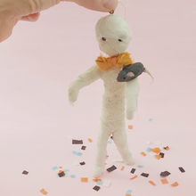 Load image into Gallery viewer, Spun cotton mummy and mouse ornament, standing with support of a hand, on Halloween confetti. Pic 3 of 8.