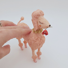Load image into Gallery viewer, Spun cotton pink poodle sculpture next to hand, for size comparison. Pic 2 of 7.