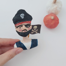 Load image into Gallery viewer, Spun cotton pirate boy ornament, held in hand for size comparison. Pic 2 of 7.