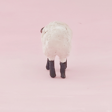 Load image into Gallery viewer, A back view of a vintage style spun cotton miniature sheep, against a pink background. Pic 7 of 8.