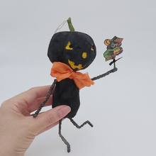 Load image into Gallery viewer, Vintage styel spun cotton black jack-o'-lantern held in hand on a white background. Pic 8 of 8.