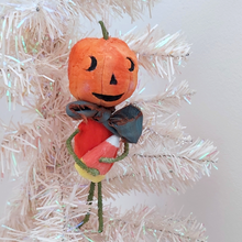 Load image into Gallery viewer, Vintage style spun cotton jack-o'-lantern man hanging on white tree against white background. Pic 2 of 8.
