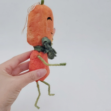 Cargar imagen en el visor de la galería, Side view of spun cotton jack-o'-lantern man held in hand on white background. Pic 6 of 8.