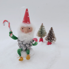 Load image into Gallery viewer, Another front view of vintage style spun cotton pine cone elf holding a red spun cotton mushroom and pipe cleaner candy cane. Pic 6 of 9.