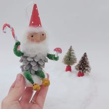 Load image into Gallery viewer, Vintage style spun cotton pine cone elf, held in hand for size comparison. Pic 3 of 9.