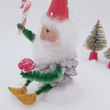 Load image into Gallery viewer, Close up side view of spun cotton pine cone elf ornament. Pic 5 of 9.