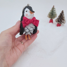 Load image into Gallery viewer, Vintage style spun cotton pine cone penguin, held in hand for size comparison. Pic 2 of 10. 
