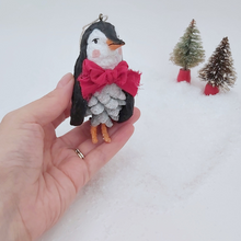 Load image into Gallery viewer, Vintage style spun cotton pine cone penguin, held in hand for size comparison. Pic 2 of 10.