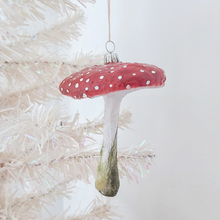 Load image into Gallery viewer, A vintage style spun cotton red mushroom ornament, hanging on a white tree. Pic 2 of 5.