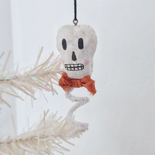 Cargar imagen en el visor de la galería, A vintage style spun cotton skeleton ornament hanging on a tree. Pic 3 of 6.