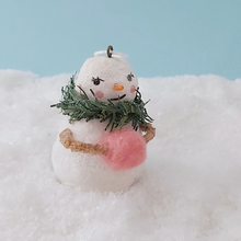 Load image into Gallery viewer, Front view of vintage style spun cotton snow lady holding pink hand muff, on fake snow against a light blue background. Pic 8 of 11.
