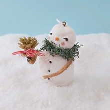 Load image into Gallery viewer, Side view of spun cotton snowman standing on fake snow, against a light blue background. Pic 5 of 11.