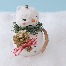 Load image into Gallery viewer, Close up of vintage gold glitter pinecone held by spun cotton snowman. Pic 4 of 11.
