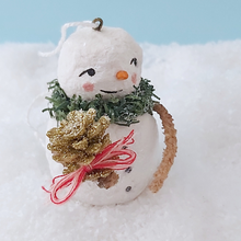 Load image into Gallery viewer, Close up of vintage gold glitter pinecone held by spun cotton snowman. Pic 4 of 11.
