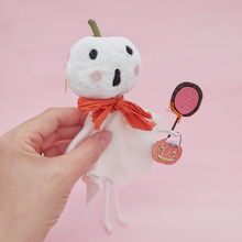 Load image into Gallery viewer, Vintage style spun cotton white jack-o-lantern ghost, held in hand on pink background. Pic 3 of 7.