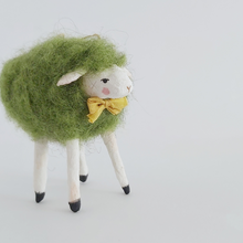 Load image into Gallery viewer, A closer view of the green needle felted sheep&#39;s face, against a white background. Pic 4 of 7. 
