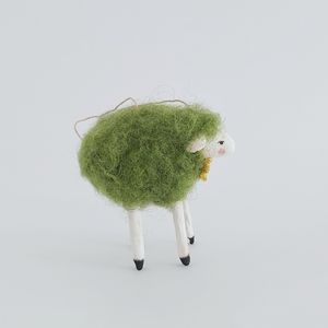 A side view of the green needle felted sheep ornament, against a white background. Pic 6 of 7. 