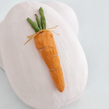 Load image into Gallery viewer, A close-up of a vintage style, light pink paper mache egg box. A spun cotton carrot adorns the front. Pic 9 of 12. 
