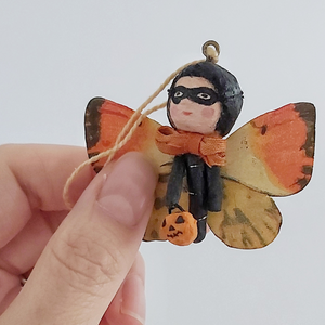 Close-up of the front of a vintage style spun cotton Halloween butterfly girl. Pic 3 of 7. 