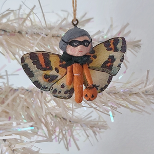 A vintage style spun cotton Halloween butterfly girl, hanging on a tree against a white background. Pic 1 of 7. 