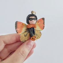 Cargar imagen en el visor de la galería, A vintage style spun cotton Halloween butterfly girl, held in hand against a white background. Pic 1 of 7. 
