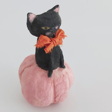 Load image into Gallery viewer, A closer view on the opposite side of a vintage style black cat, sitting in a pink pumpkin against a white background. Pic 4 of 7. 
