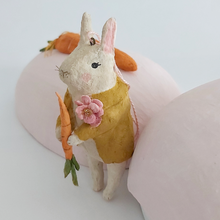 Load image into Gallery viewer, A close-up photo of a vintage style, spun cotton bunny ornament leaning against a light pink paper mache egg box. Pic 4 of 12. 

