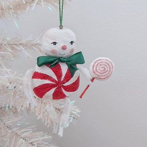 A vintage style spun cotton candy man Christmas ornament hanging from a white tree. Pic 4 of 8. 