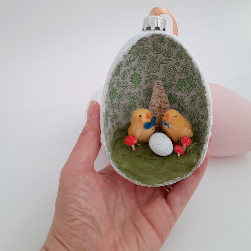 A vintage style spun cotton chicks Easter diorama ornament, held in hand against a white background. Pic 1 of 7